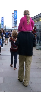 Child on father's shoulders