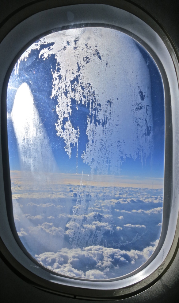 Frost on plane porthole