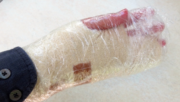 Hand in cling film