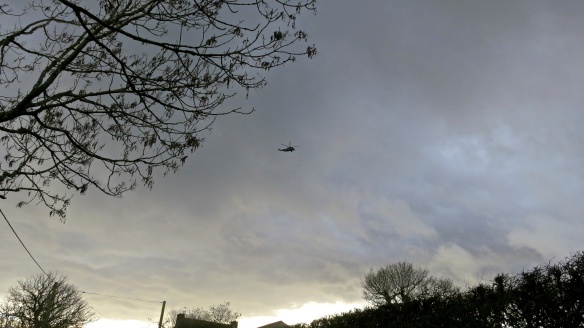 Helicopter in threatening sky