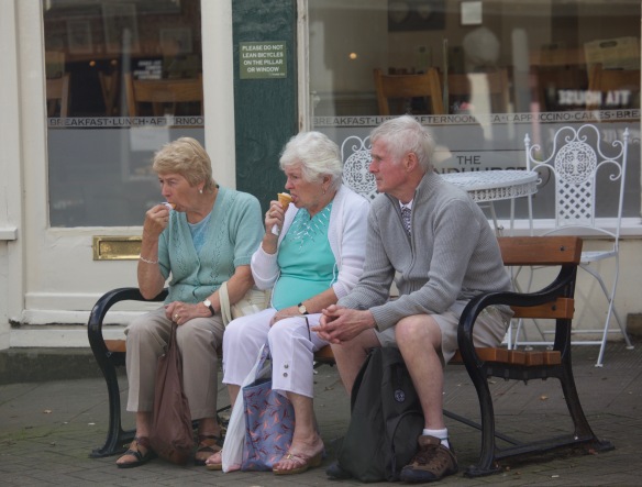 Ice cream eaters on bench