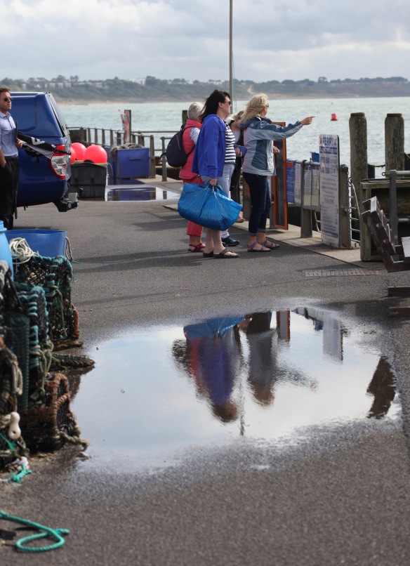 Queuing for ferry with reflection