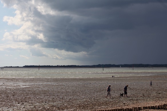 Beach scene with louring clouds