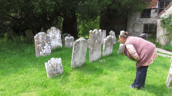 Jackie examining gravestones