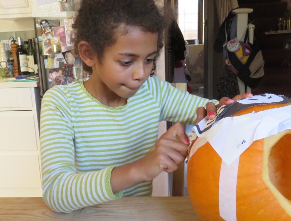 Jessica carving pumpkin