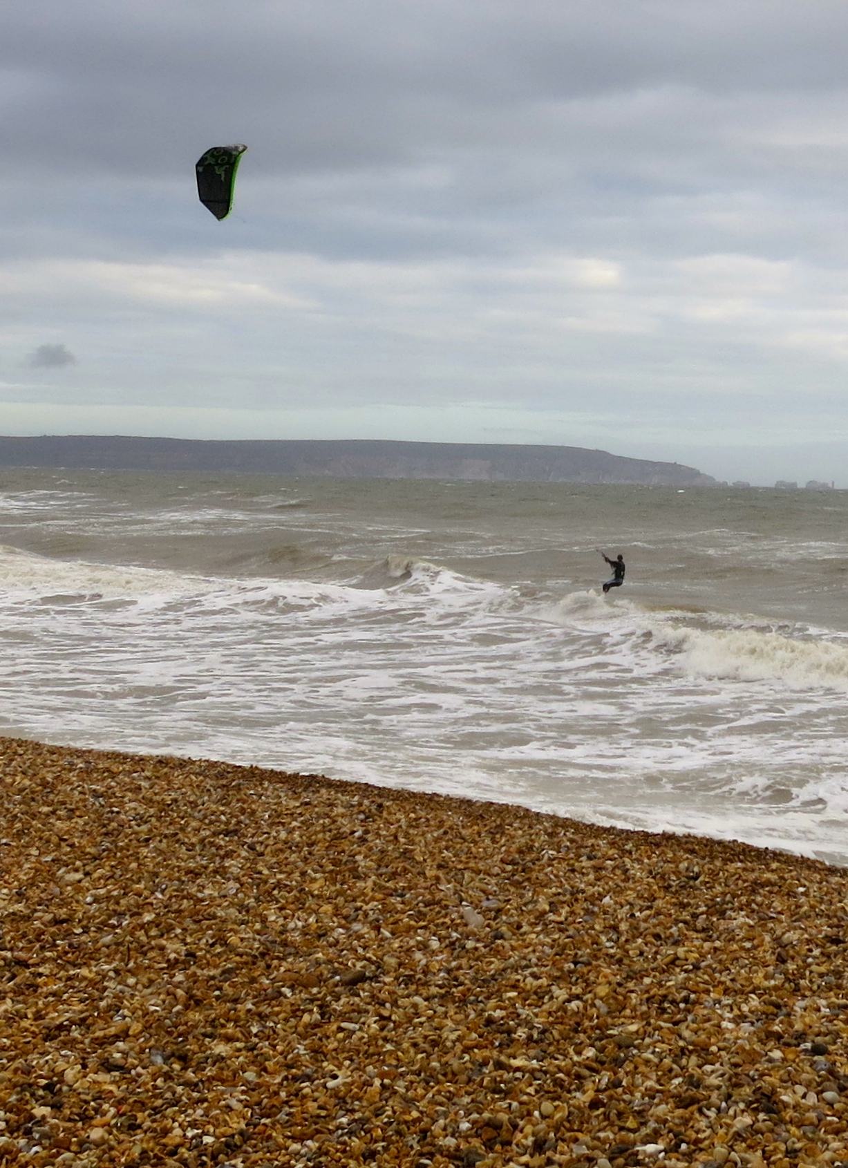 Kite surfer, shingle, Isle if Wight & The Needles