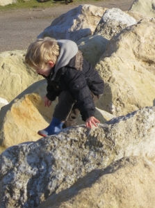 Malachi climbing rocks 1.13