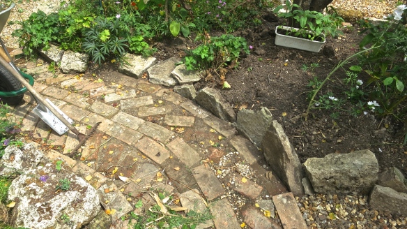 Oval bed brick path