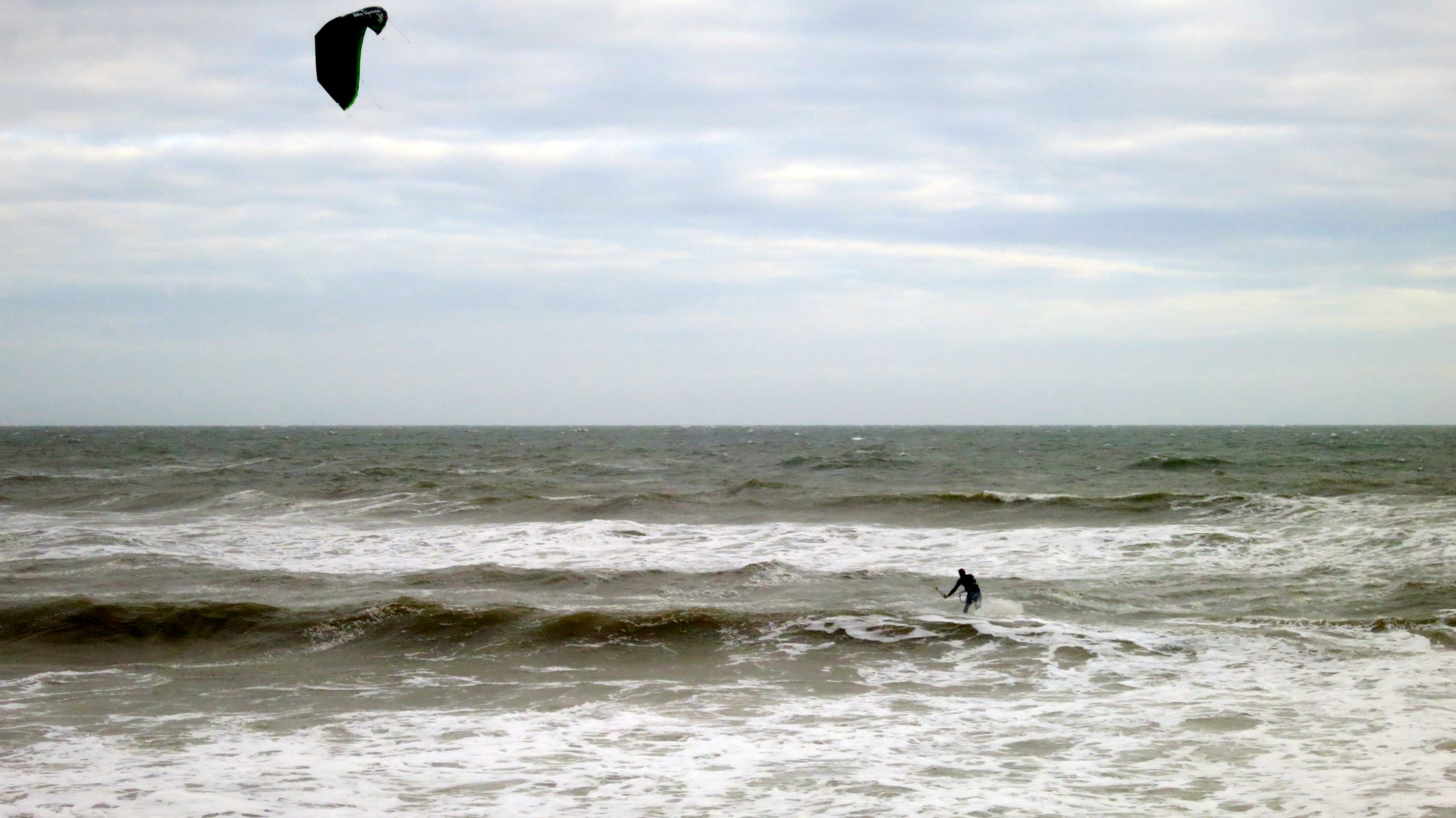Seascape with kite surfer