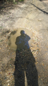 Shadow over pothole