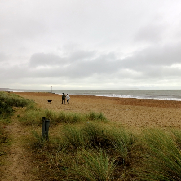 Walkers on Highcliffe beach 11.12