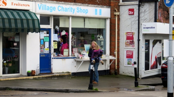 Woman and child outside charity shop
