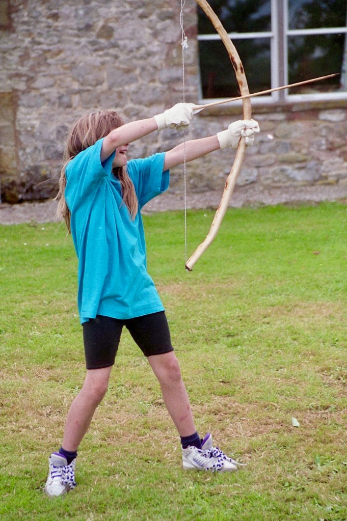 Louisa firing bow and arrow 21.8.92 1