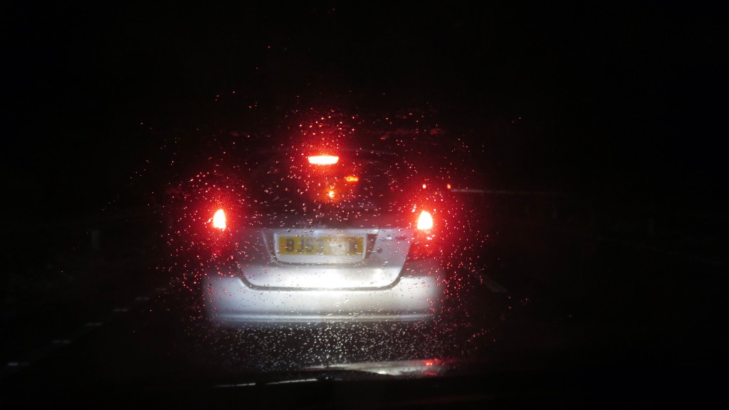 Car lights through wet windscreen
