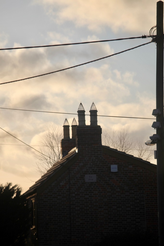 Rooftop, chimney caps, telephone wires