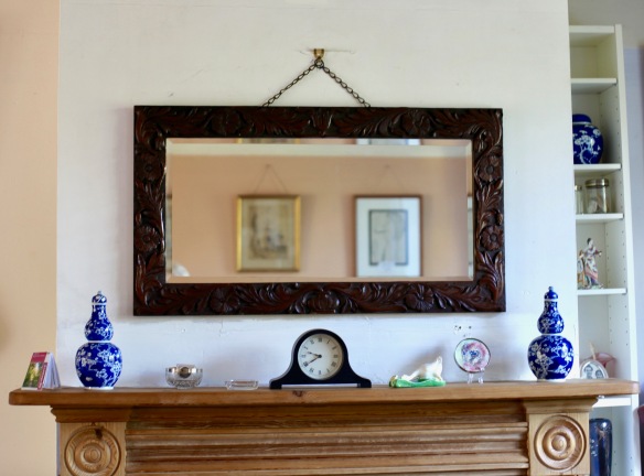 Mirror and mantelpiece