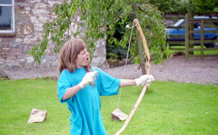 Louisa firing bow and arrow 21.8.92 3