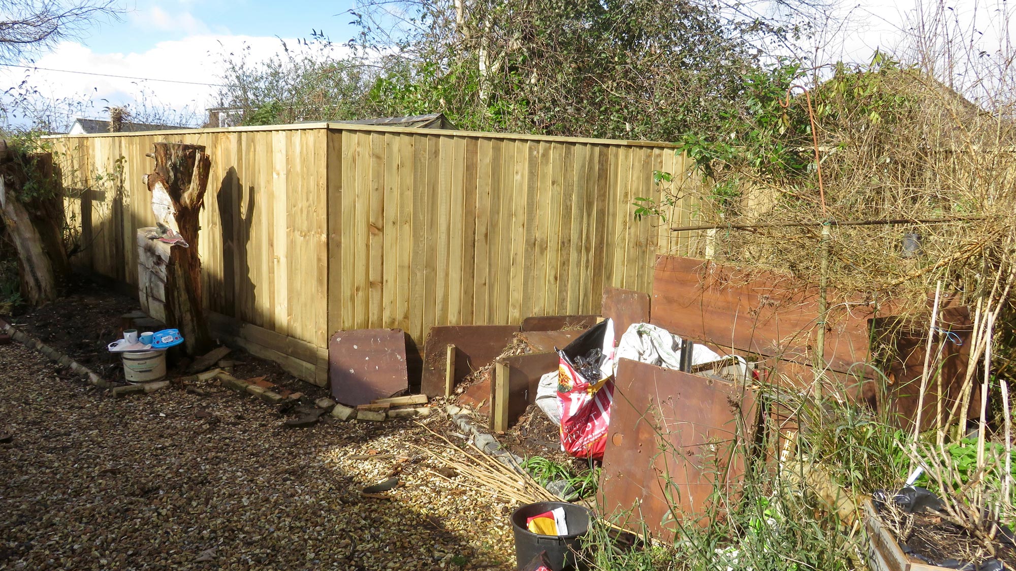 Fence and compost bins